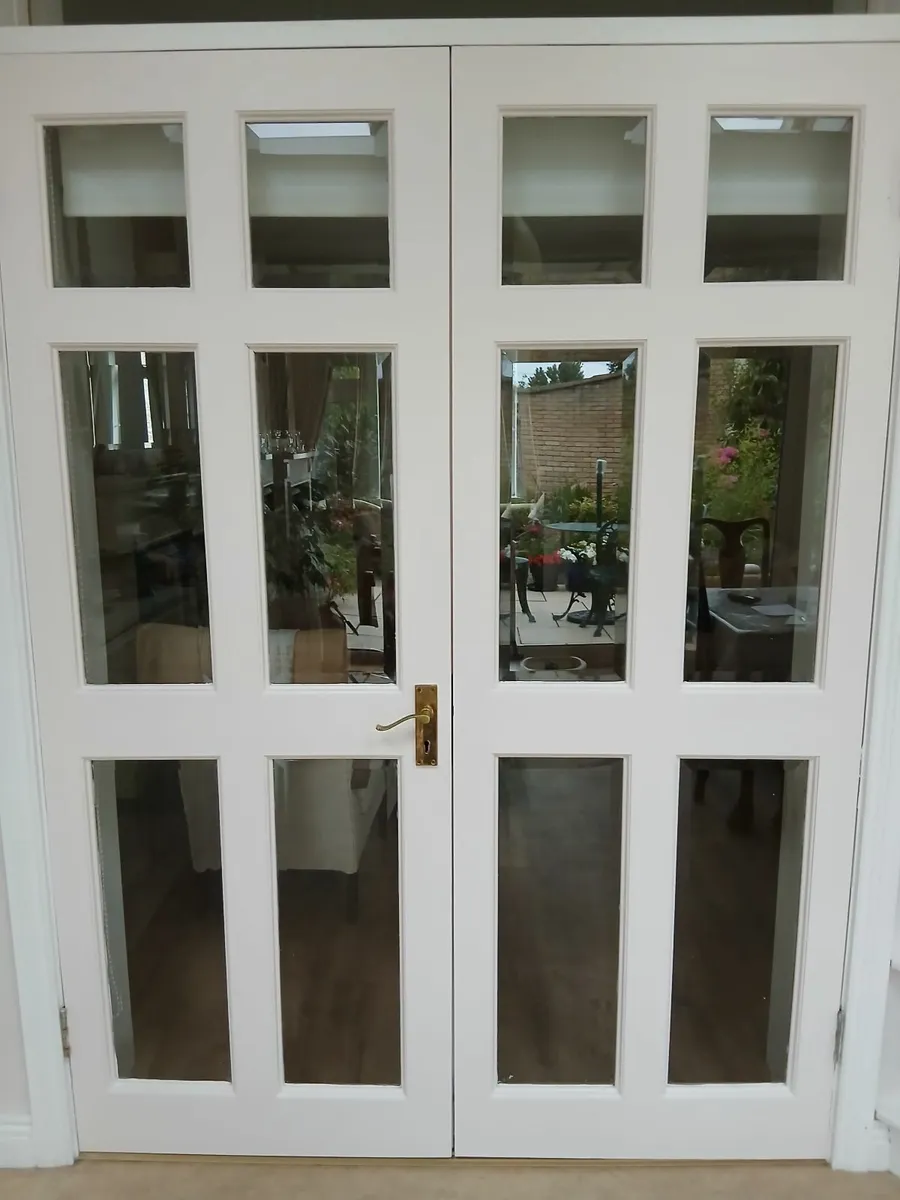 Wooden double  doors, with bevelled glass.