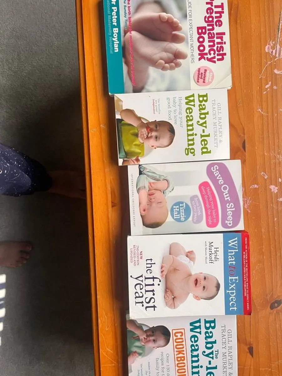 assortment of baby books