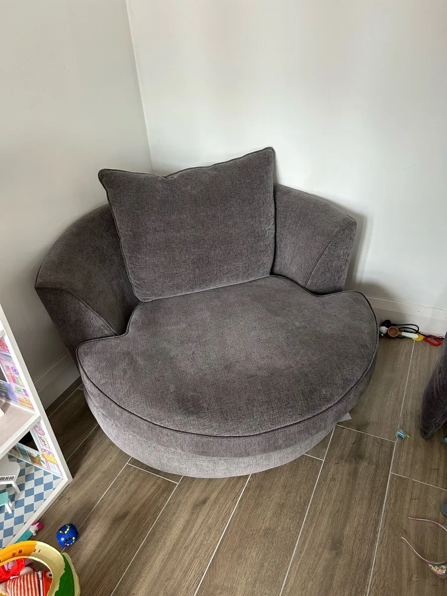 Grey swivel love chair for sale