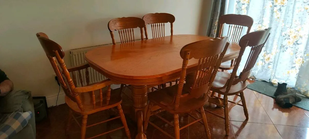 Extendable solid wood dining table and six chairs - Image 1