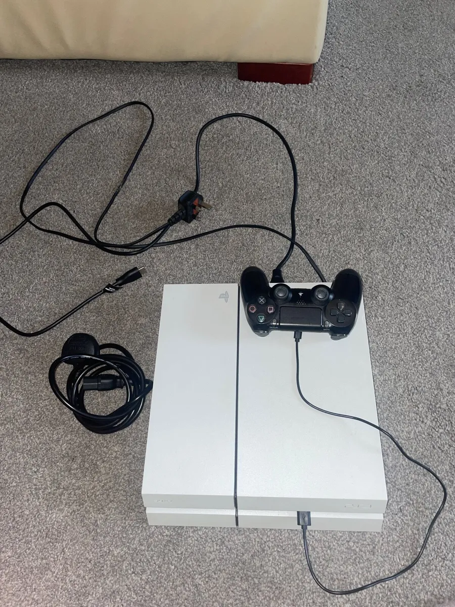 PlayStation 4 with controller, charger and cables. - Image 1
