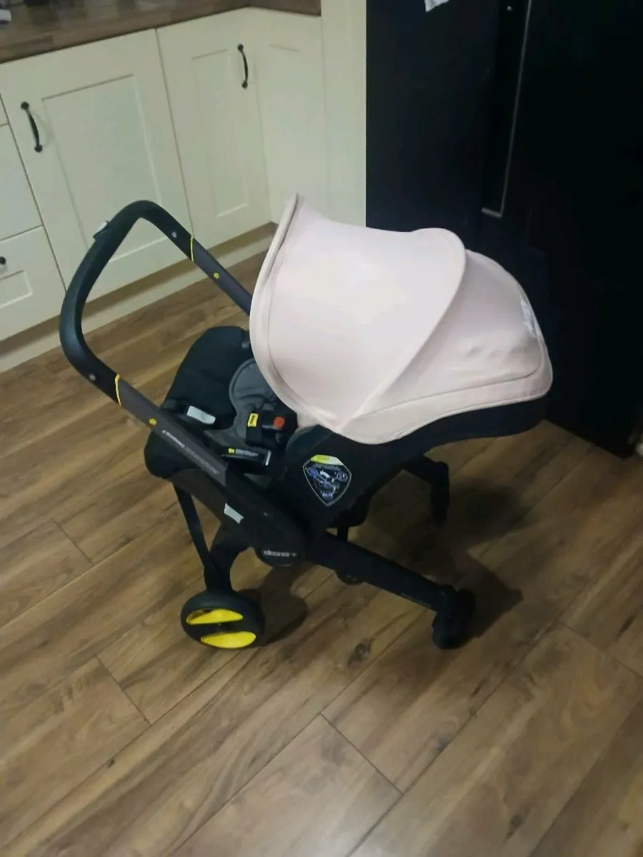Doona car seat/ stroller with isofix - Image 1