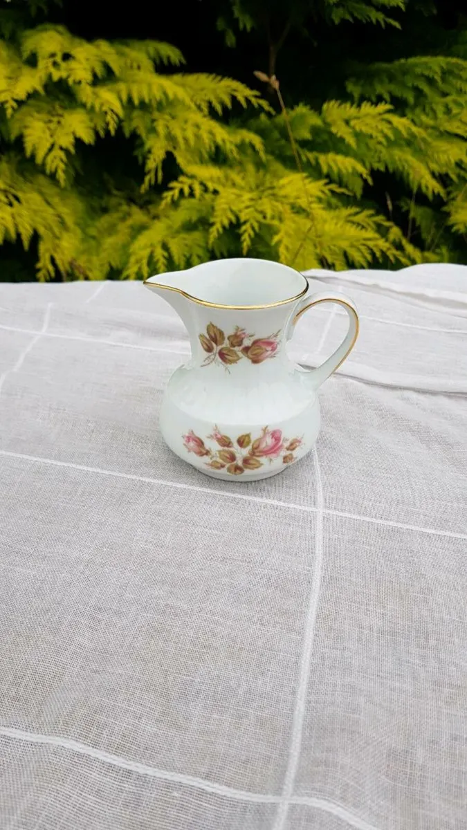 Rose china milk jug postage possible