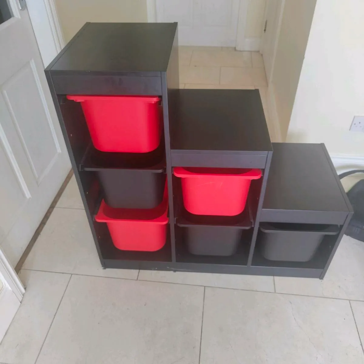 Black IKEA Trofast stepped storage unit - Image 1