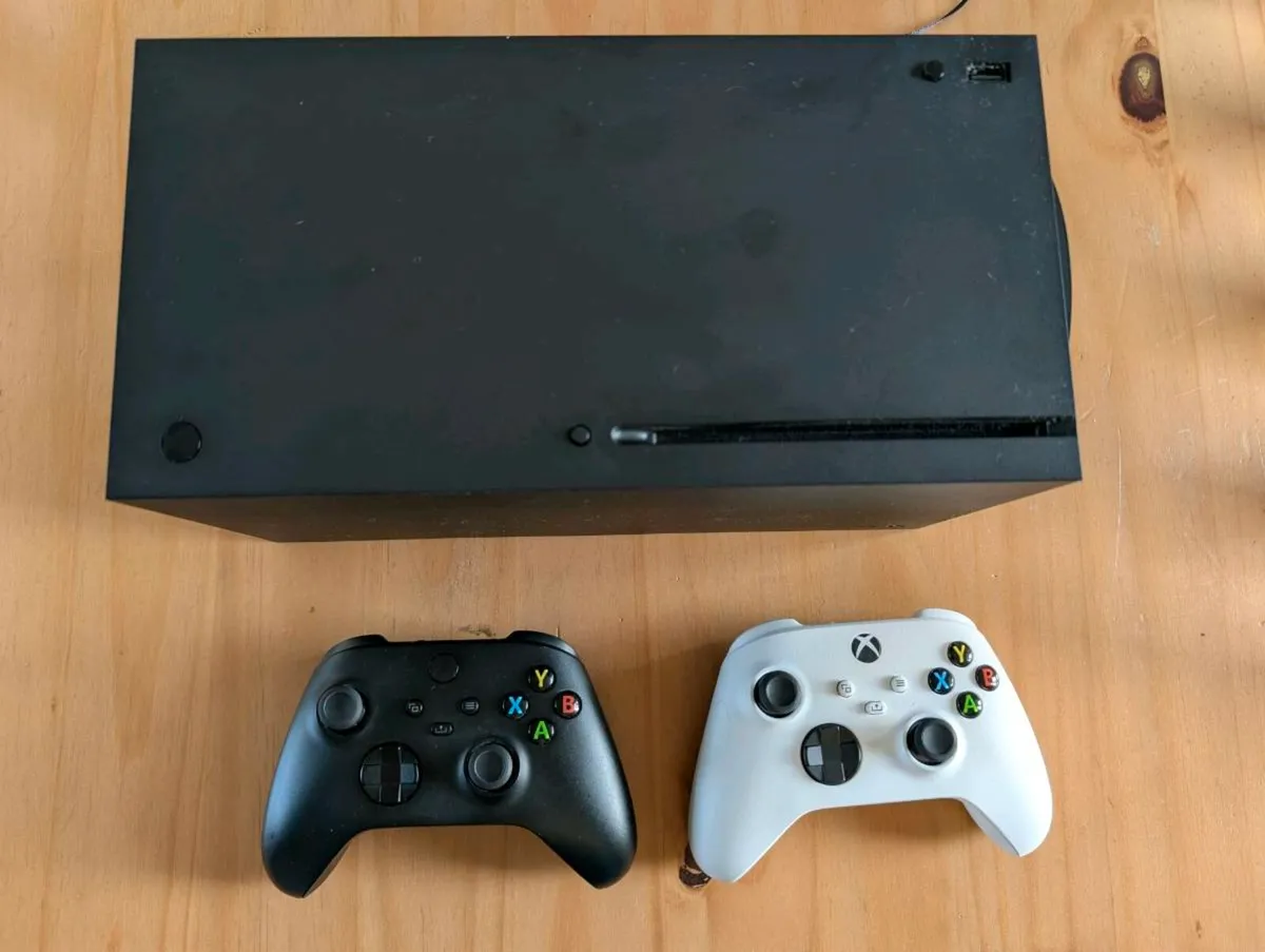 Xbox series X with 2 controls and rechargeable bat