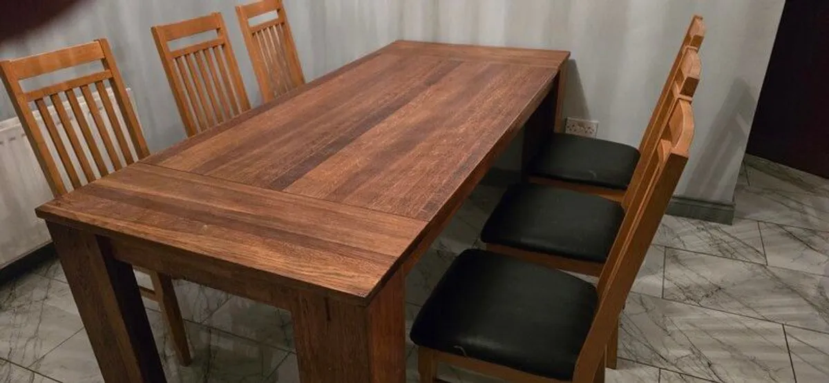 large solid wood table and 6 chairs - Image 1