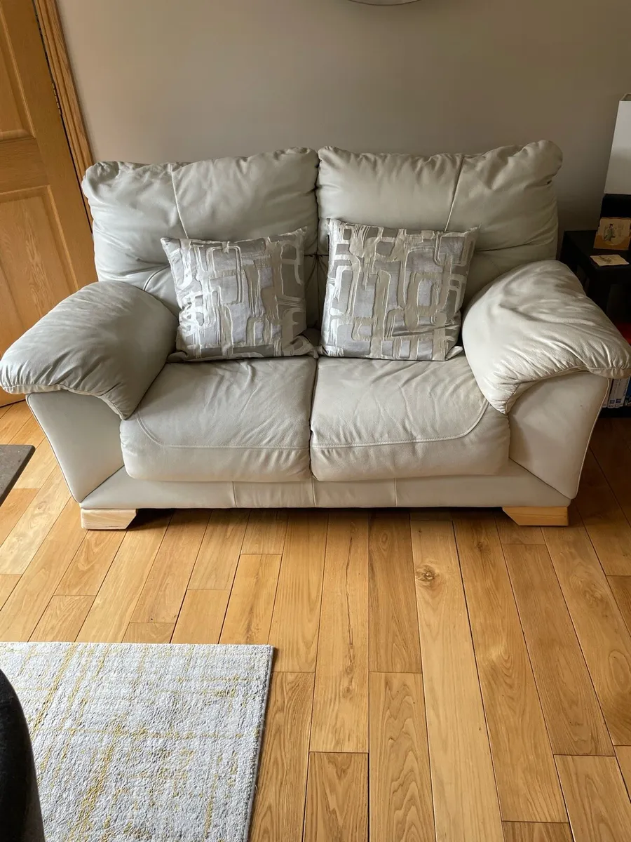 White Leather Two Seater Settee.