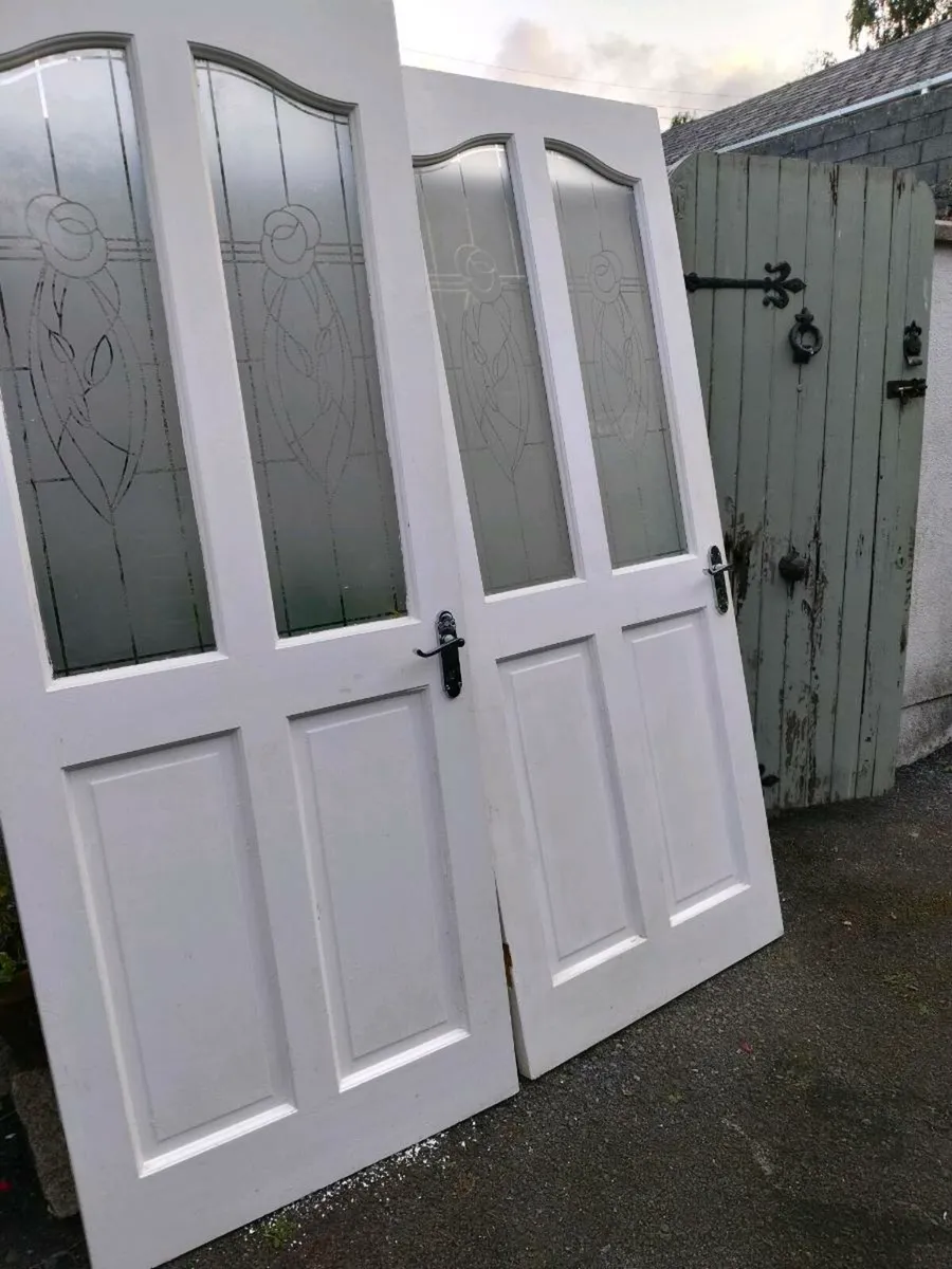 2 white solid timber doors with 2 glass panels. - Image 3