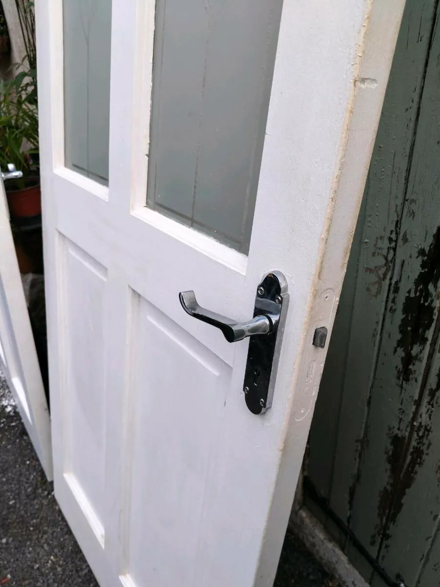 2 white solid timber doors with 2 glass panels. - Image 4
