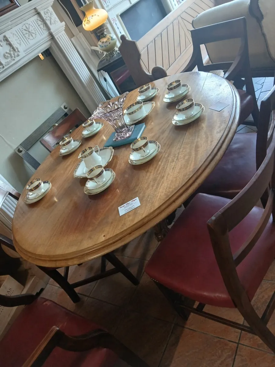 antique oval  dining table and chairs