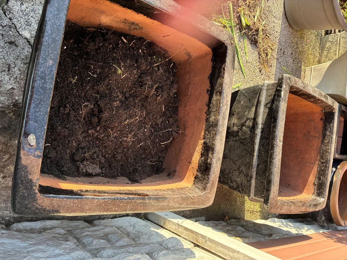 2 Black glazed stone flower pots