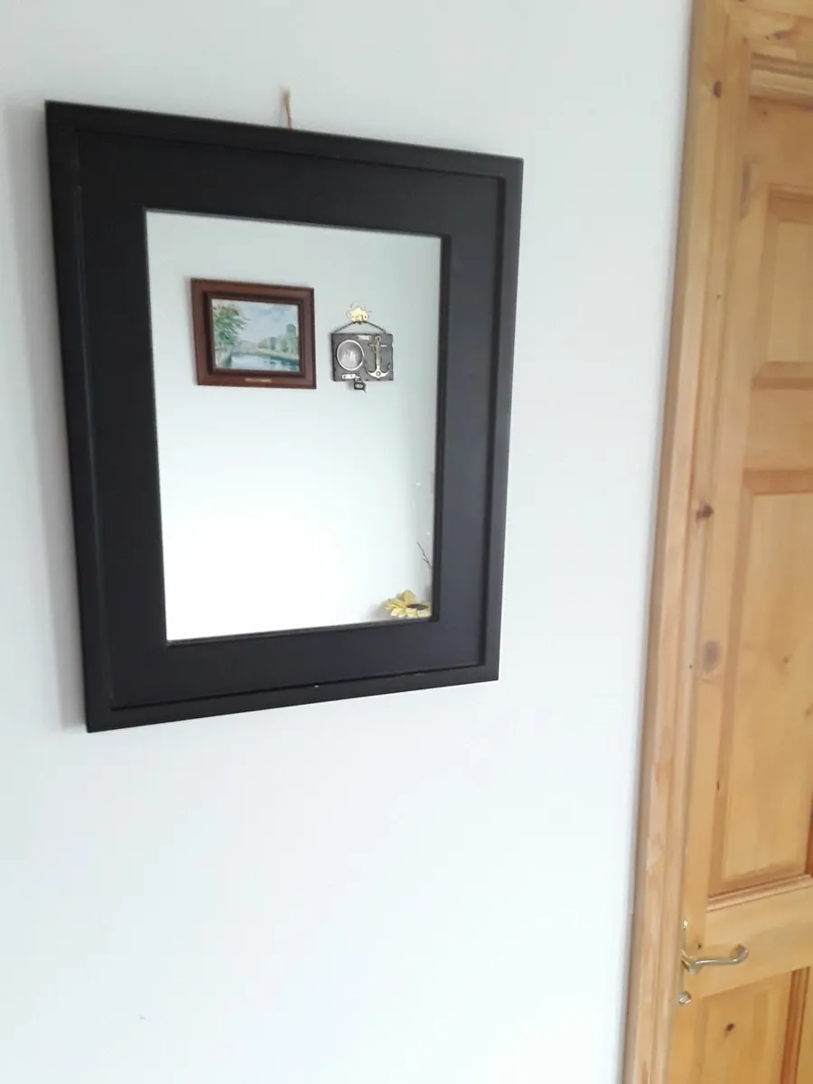 Mirror in black frame in good condition - Image 1