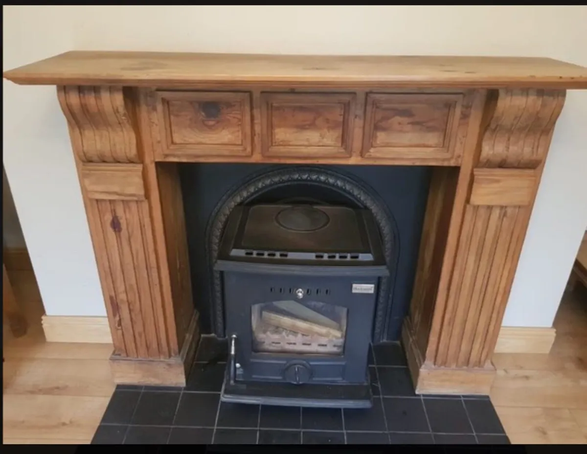 Fireplace surround and cast iron insert