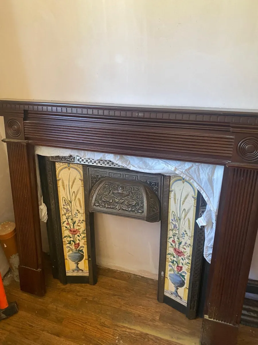 Cast iron fire place with tile inlay and mahogany - Image 1