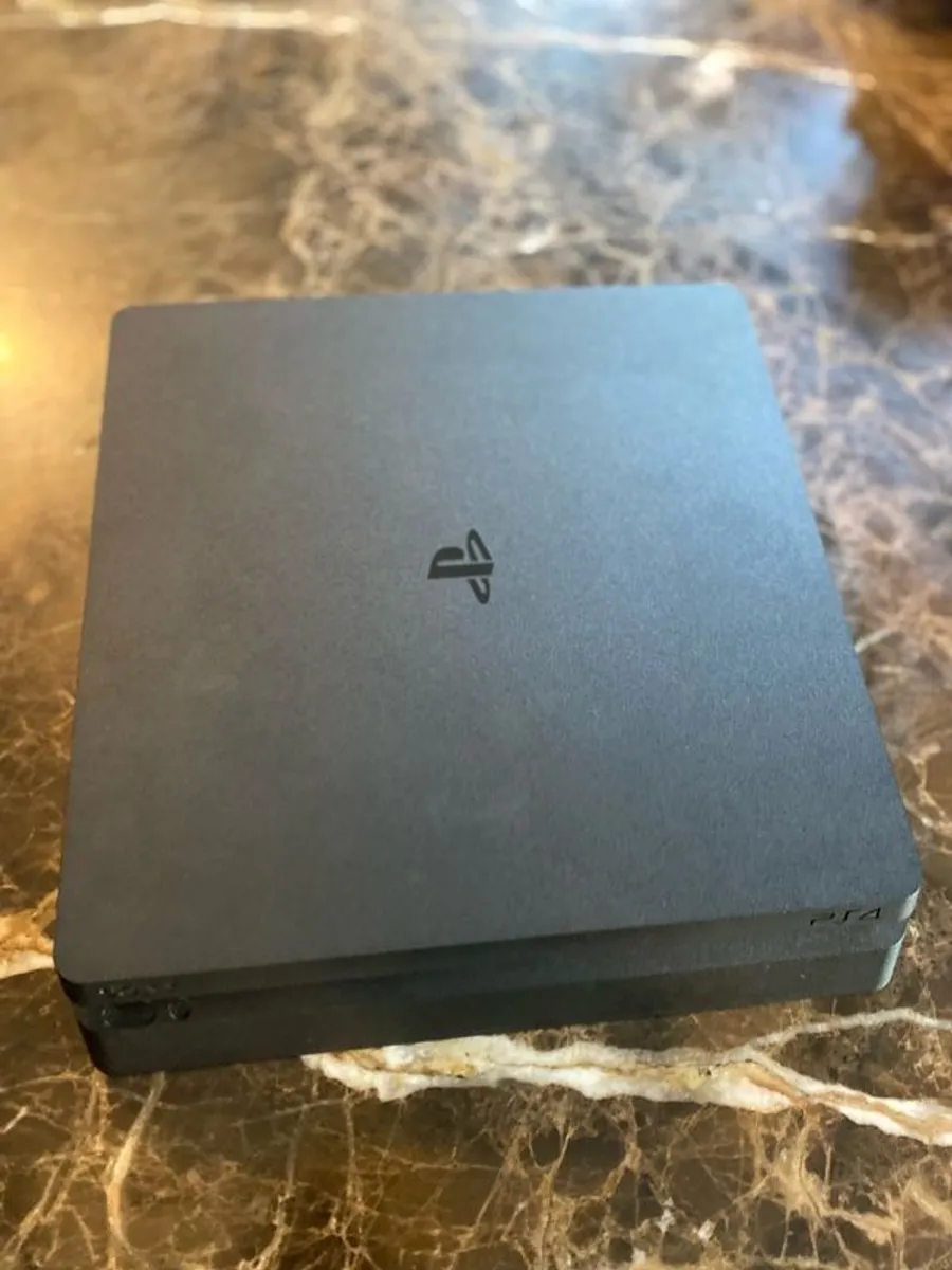 PS4 with DualShock4 controller and headset. - Image 2