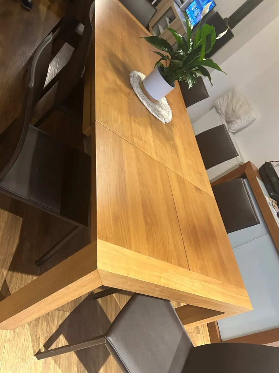 Dinning table and 8 chairs - Image 1