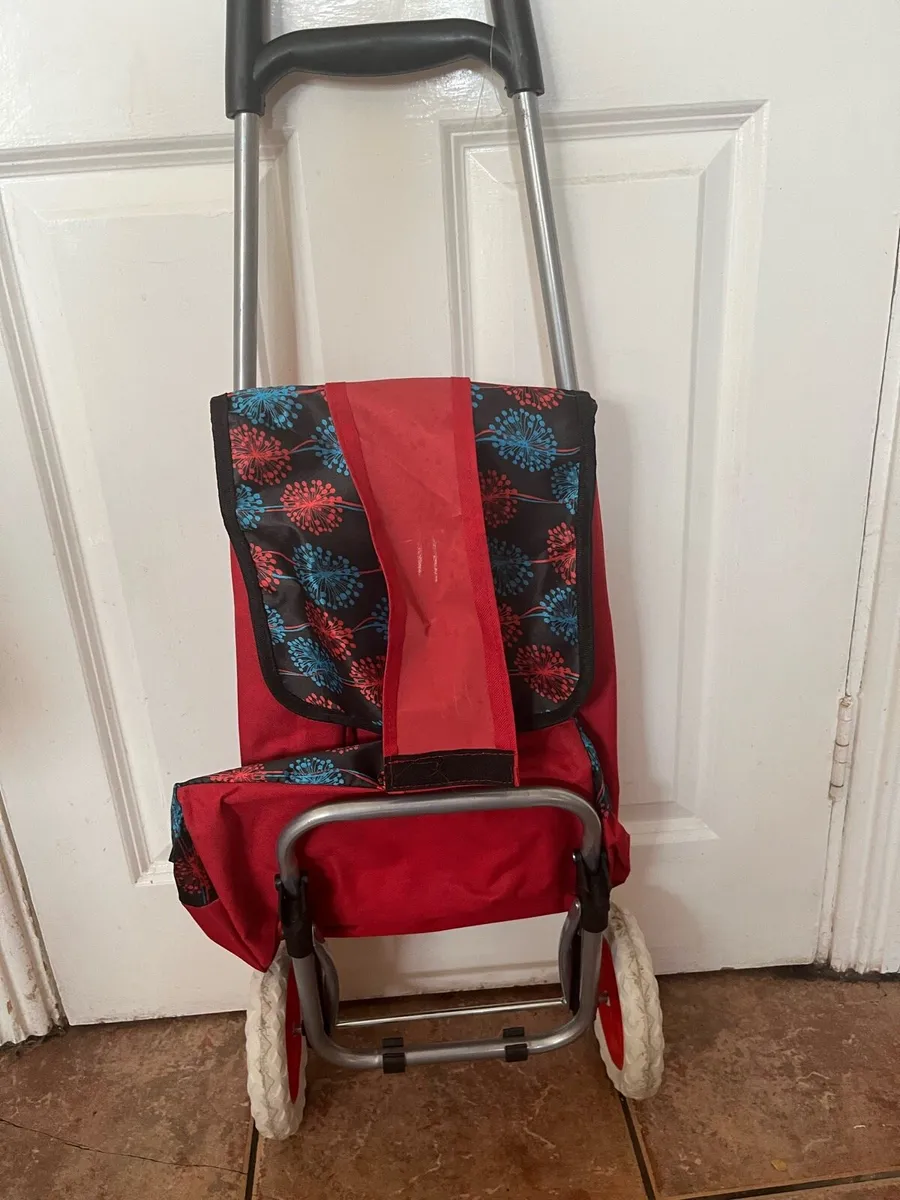 Red Shopping Trolley with Wheel - Image 1