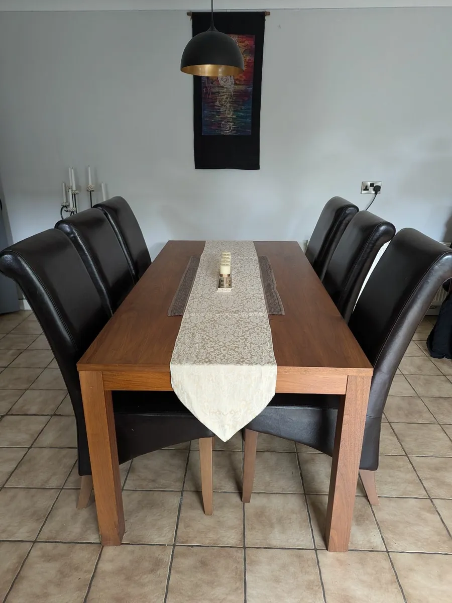 Walnut table and 6 brown leather chairs
