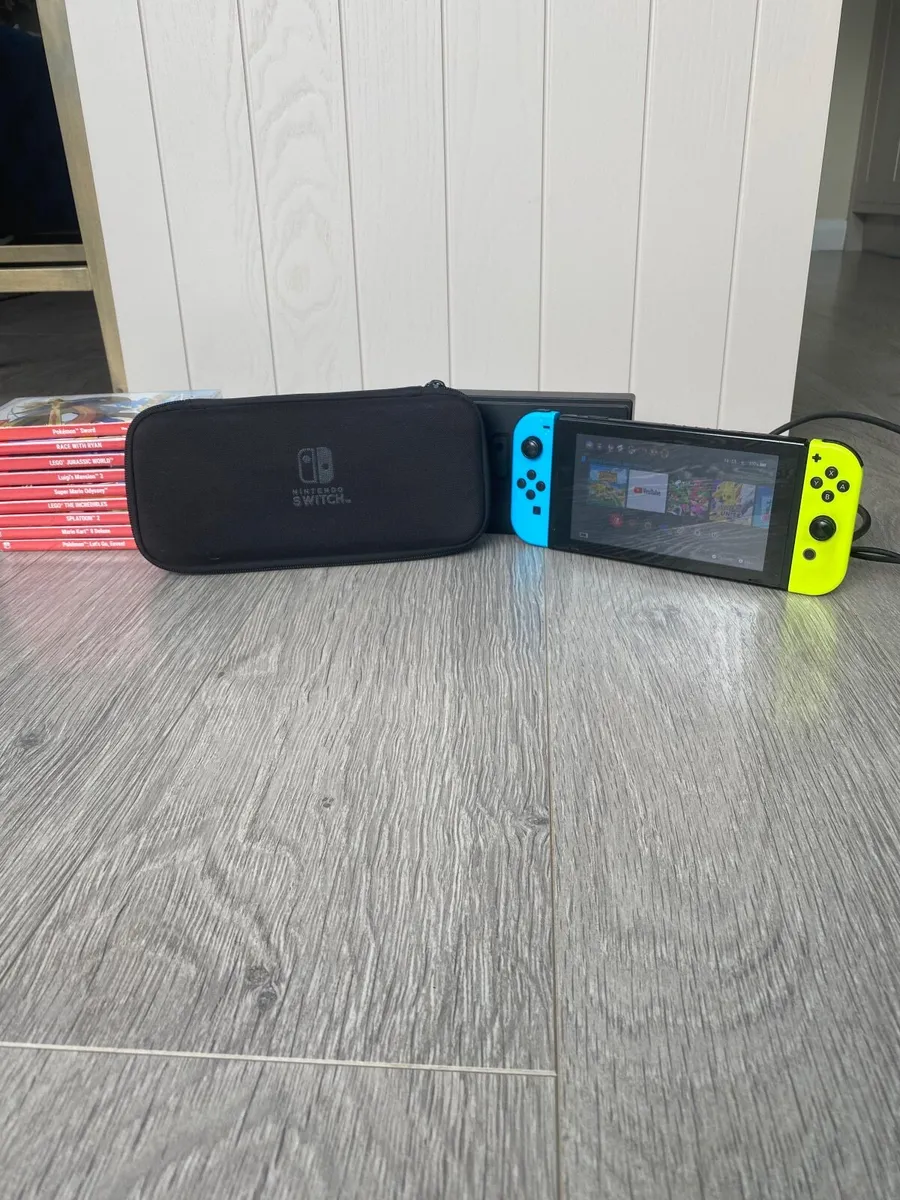 Nintendo switch, charger, stand, case and 9 games - Image 2