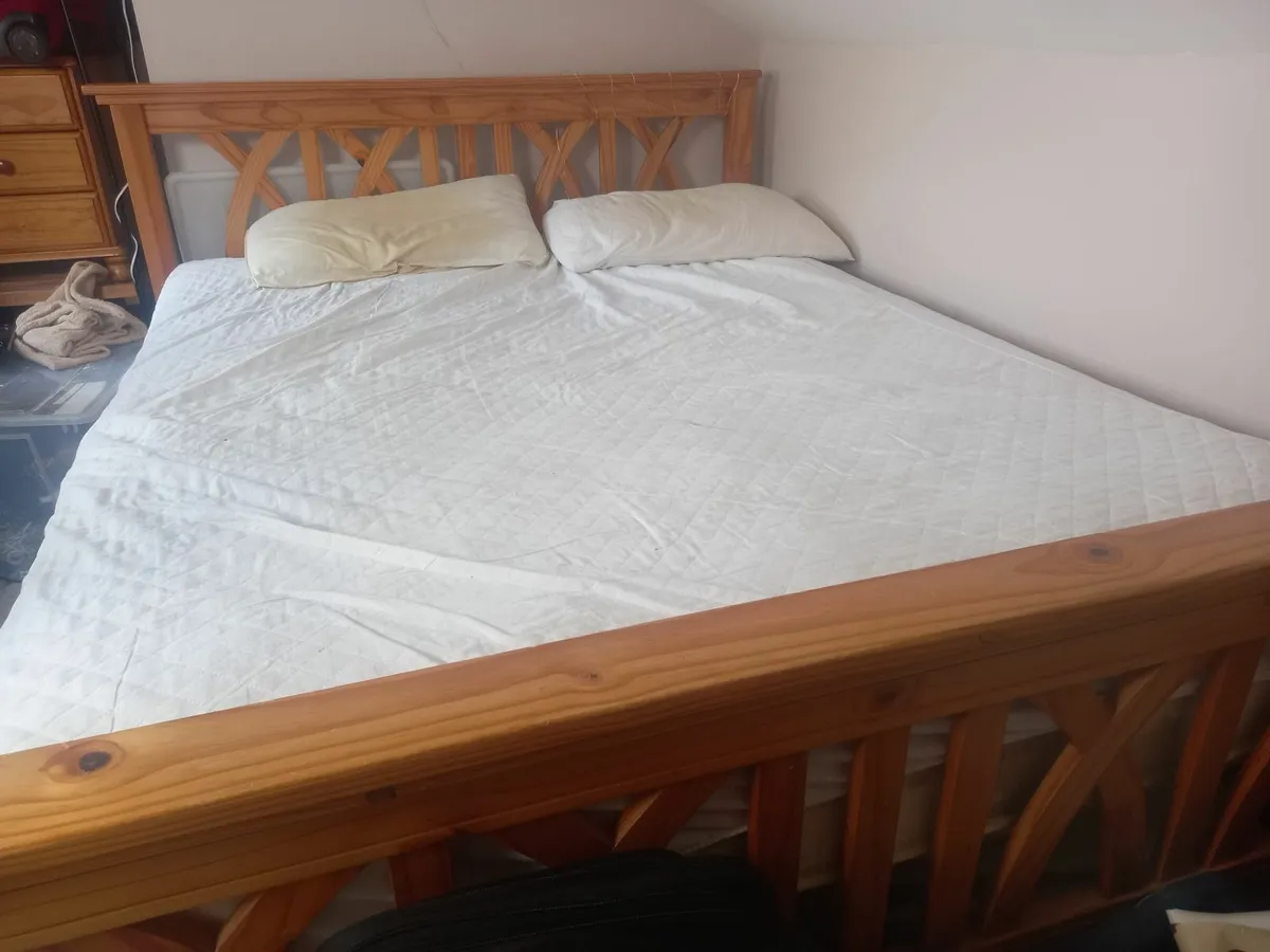 A double bed and a bedside locker - Image 1