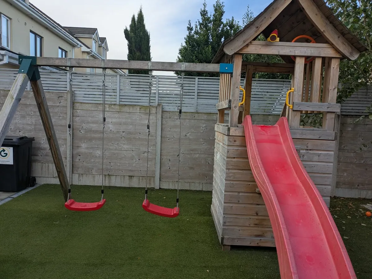 Garden playhouse with slide and swings - Image 1