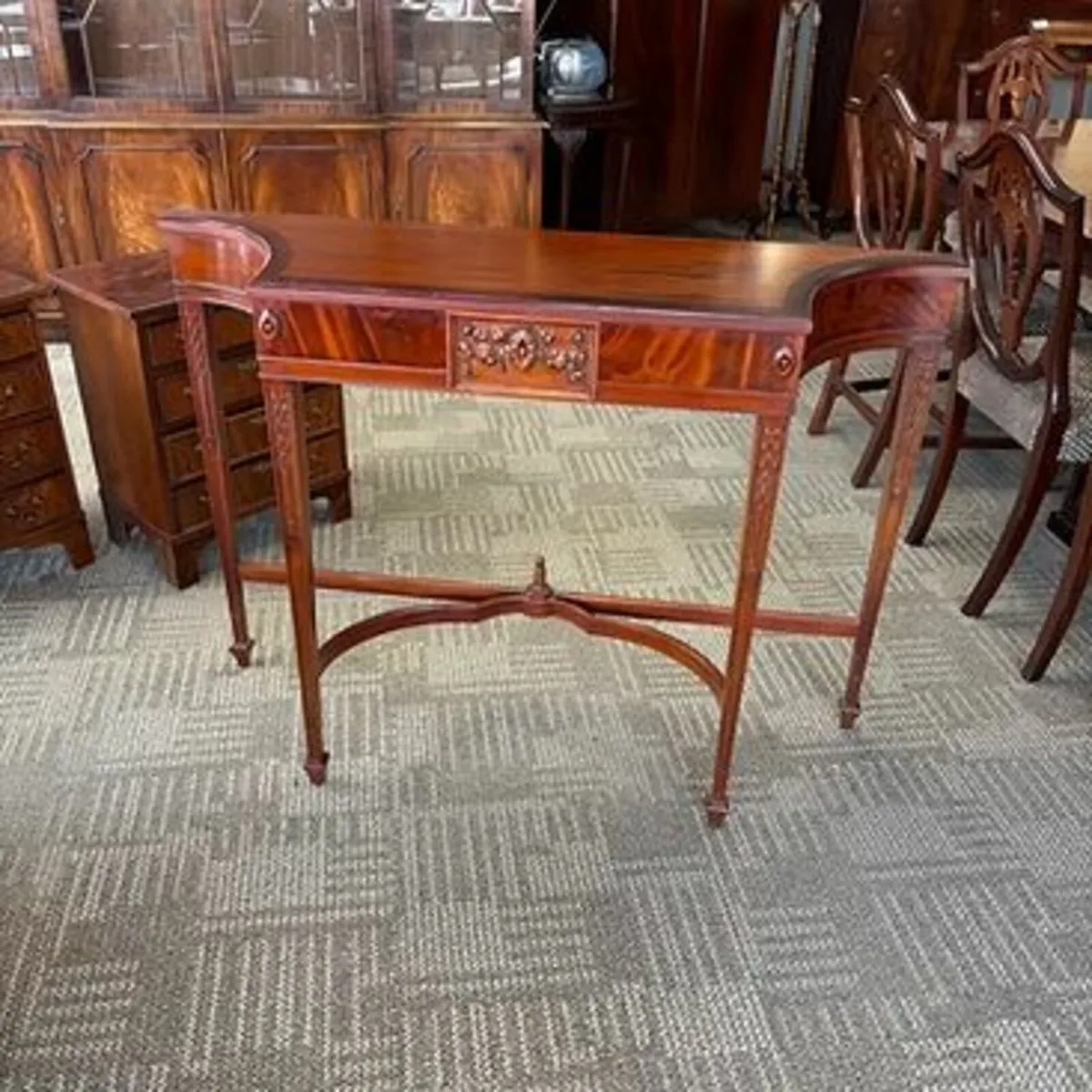 Fabulous mahogany shaped front console tier table.