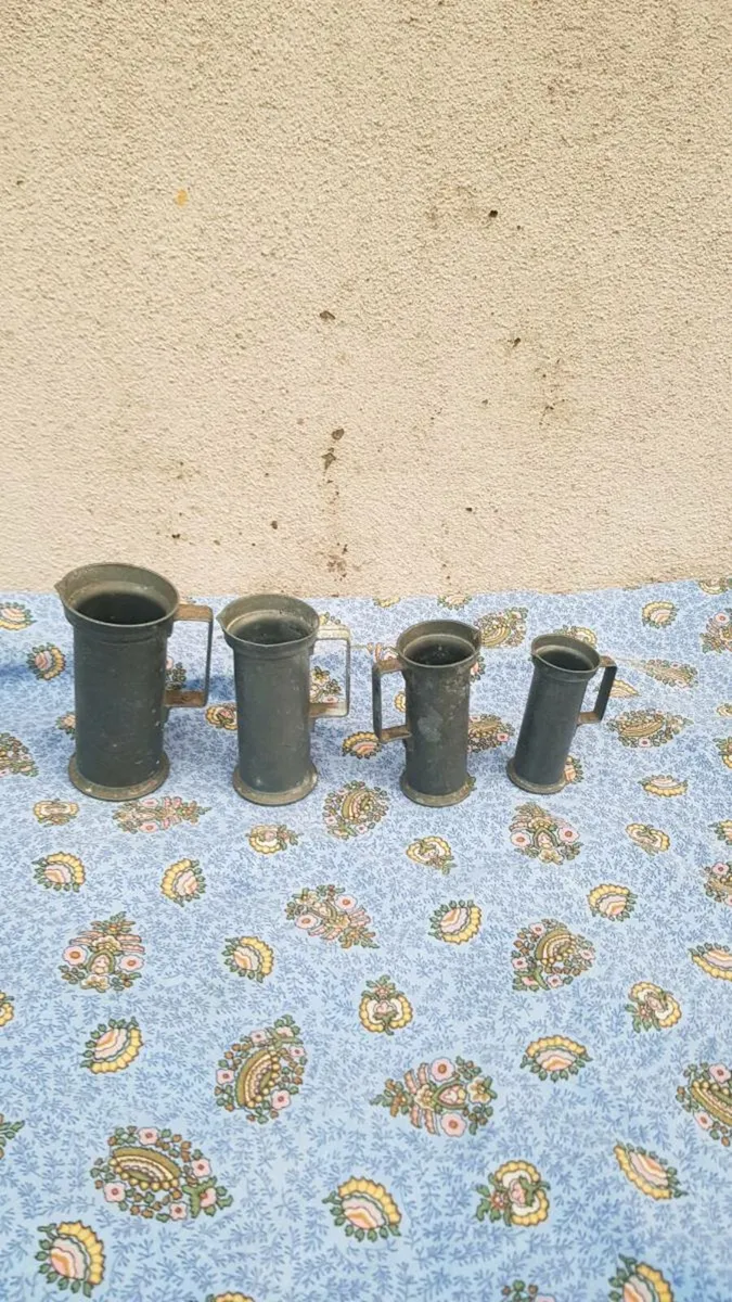 4 pewter jugs postage possible