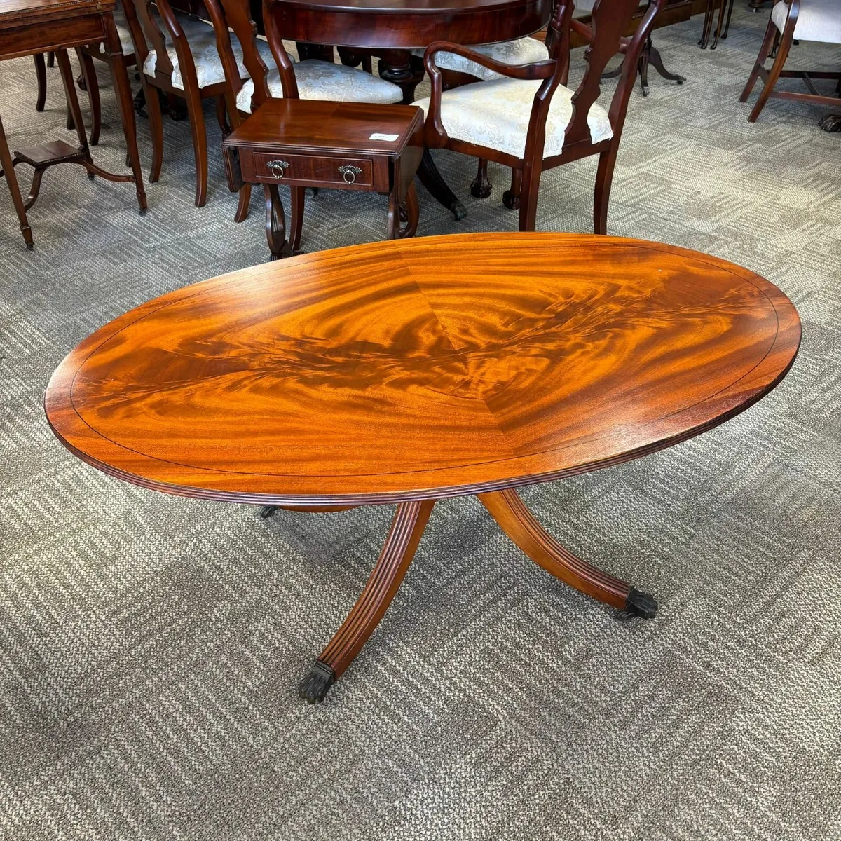 Fabulous mahogany flamed oval shaped coffee table - Image 1