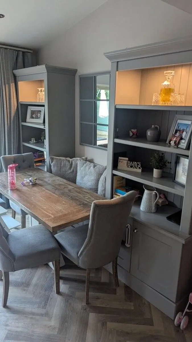 Built in, wooden display cabinets with integrated bench and bespoke kitchen table - Image 1