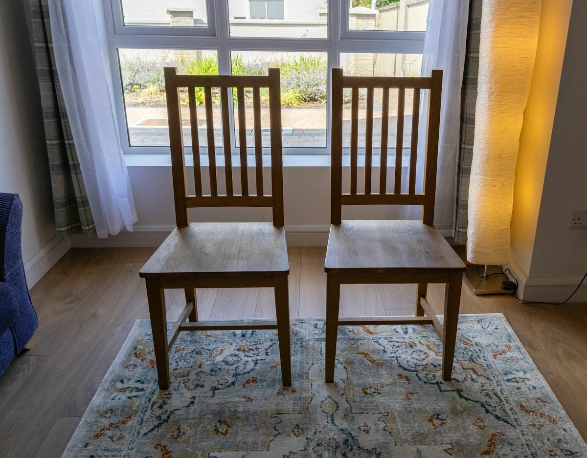 Solid Oak pair of chairs