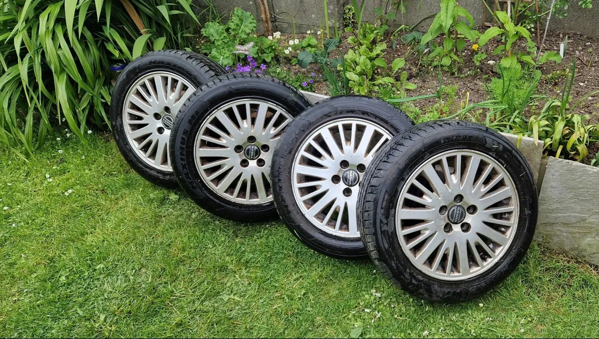 Volvo alloy wheels with tires - Image 1