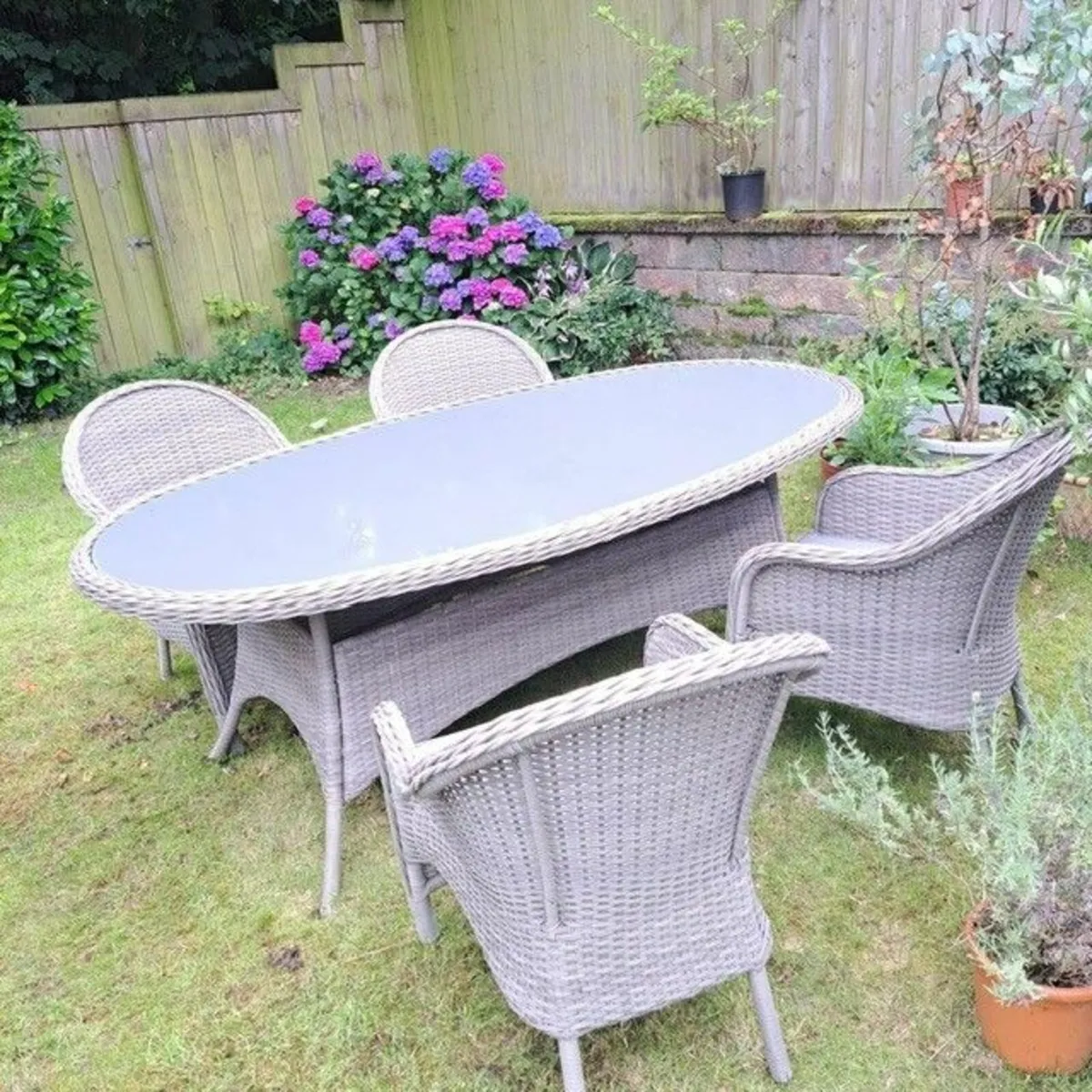 Grey wicker garden table and 4 chairs - Image 1