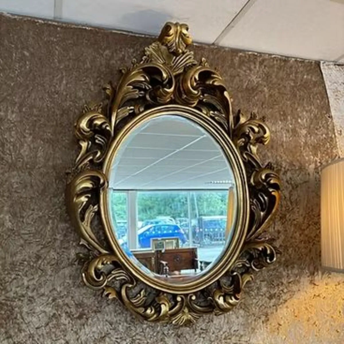 Fabulous gilt ornate oval shaped wall mirror