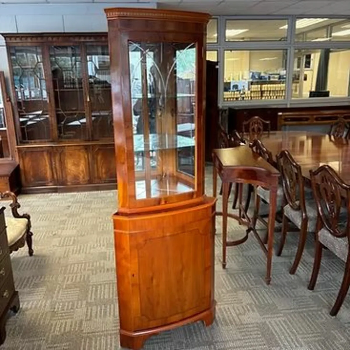 Beautiful yew bow front corner unit, with a light