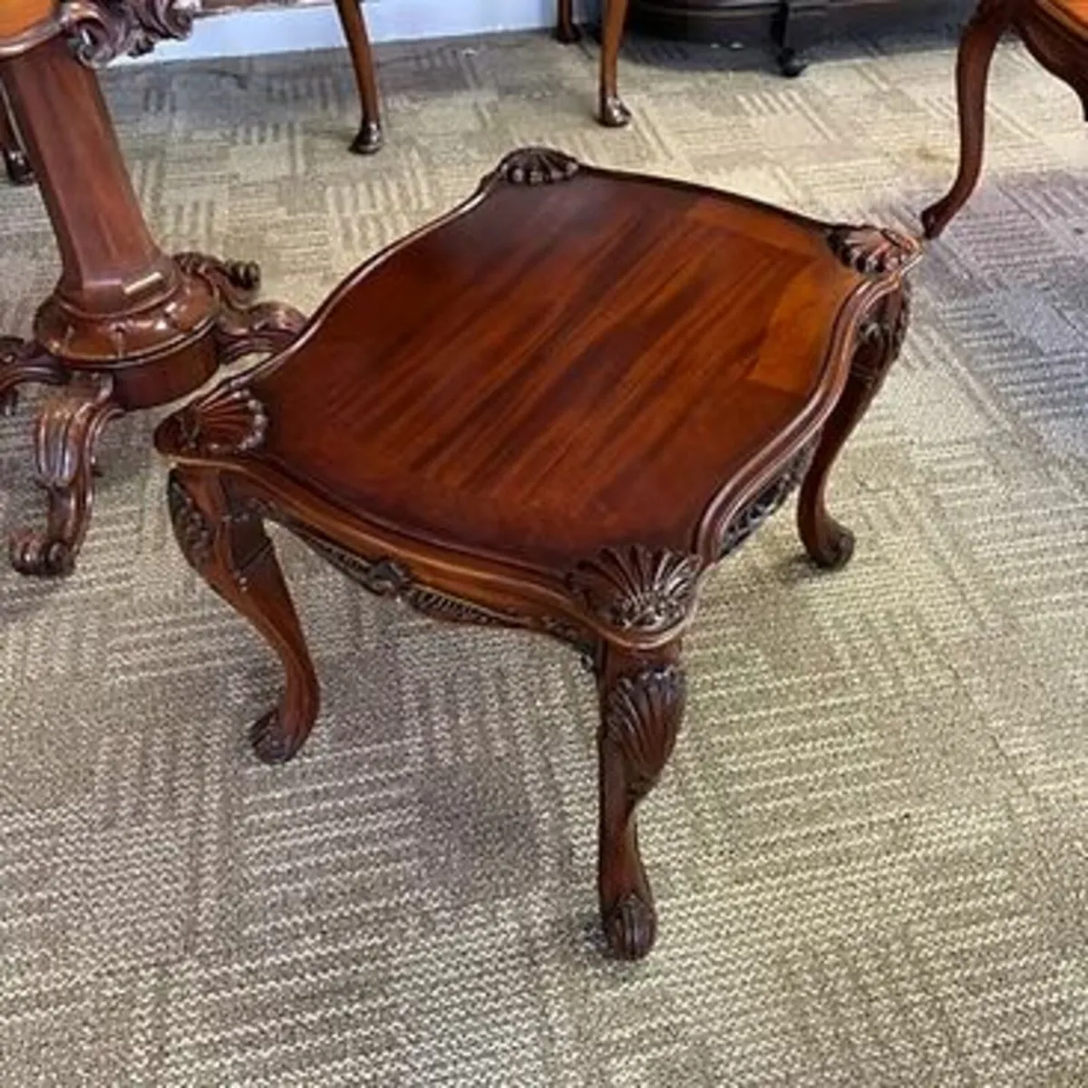 Fabulous mahogany ornately shaped coffee table. De