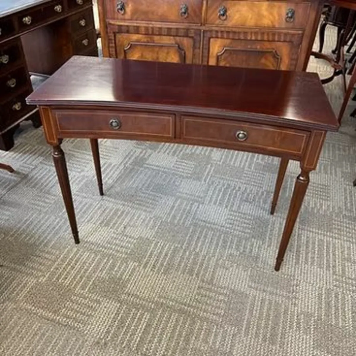 Beautiful mahogany concave console table. Enclosed