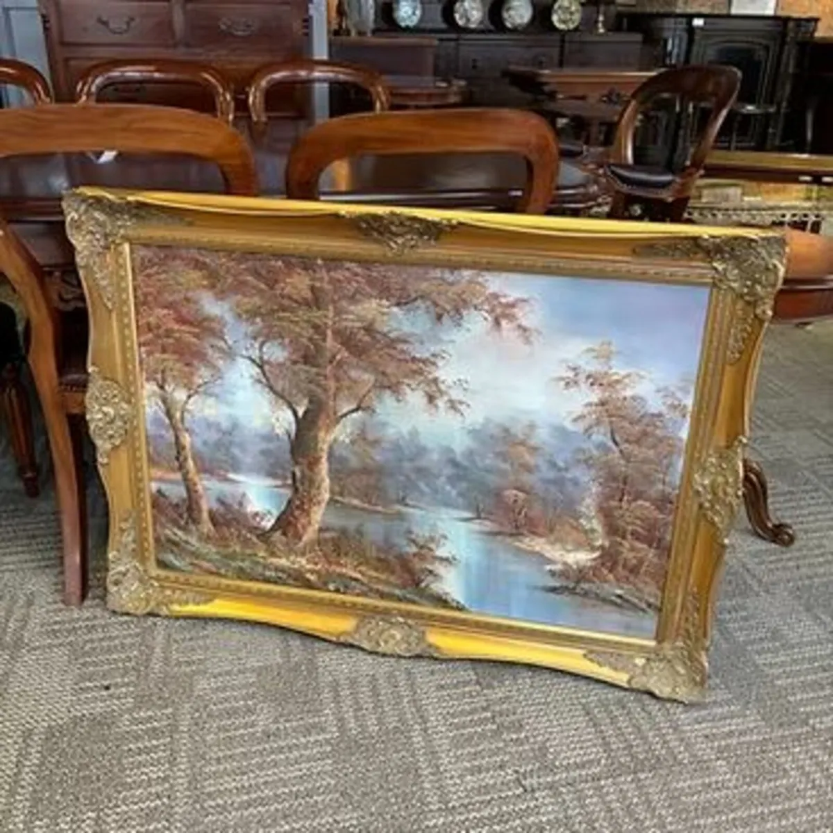 “Riverside setting mountainous view” oil on canvas