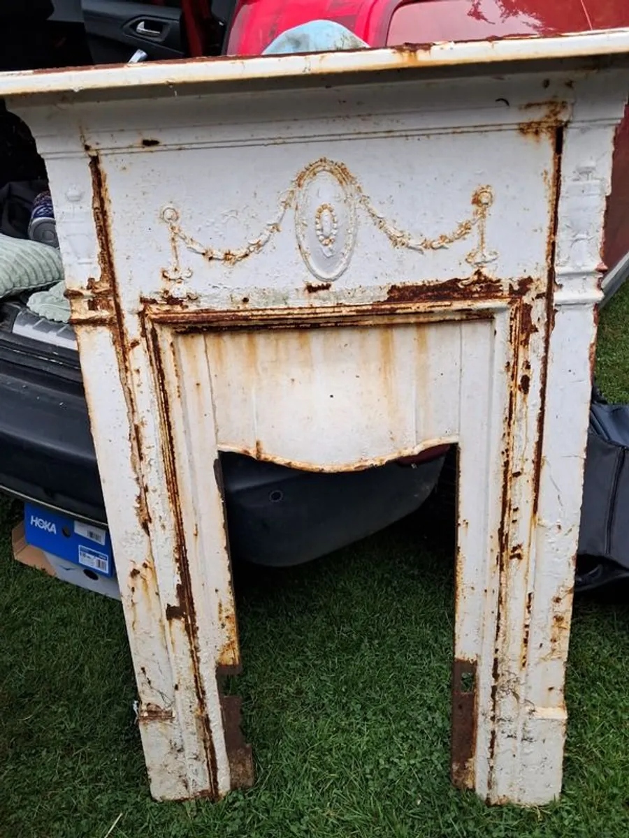 Antique wrought iron fire surround