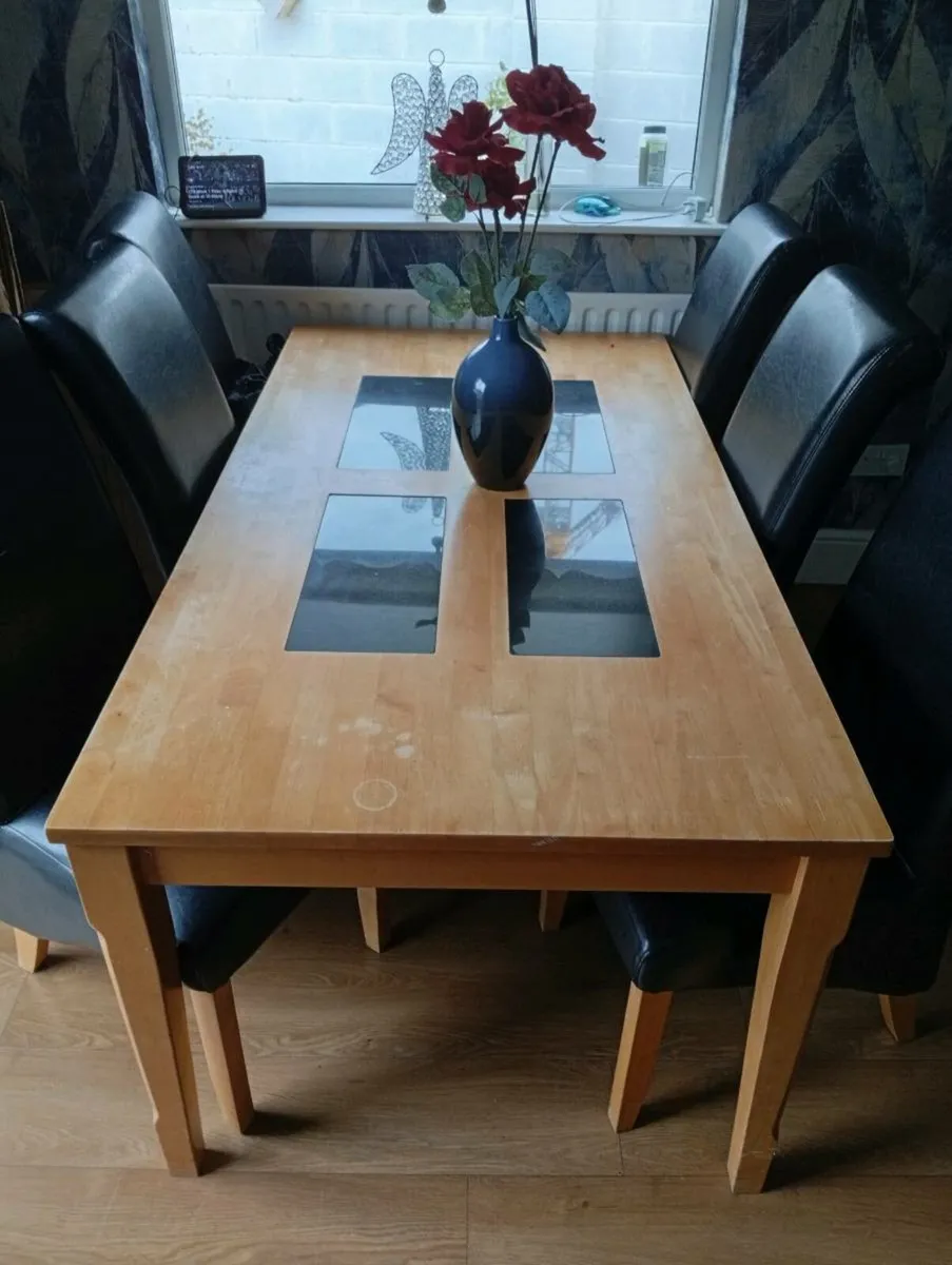 Dining table six leather chairs