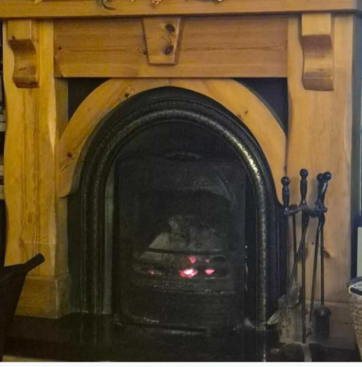 Fireplace - wooden mantlepiece & cast iron surroun