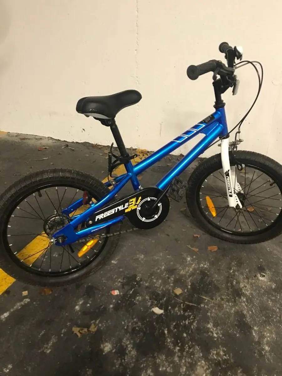 kids bike with helmet and supports - Image 1