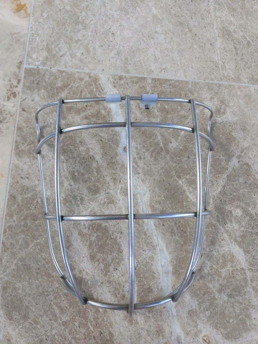 Face guard for hurling helmet.