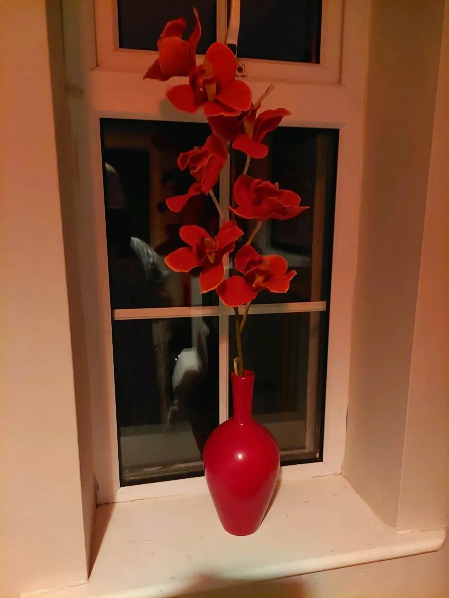 Pretty red vase with single artificial flower stem - Image 1