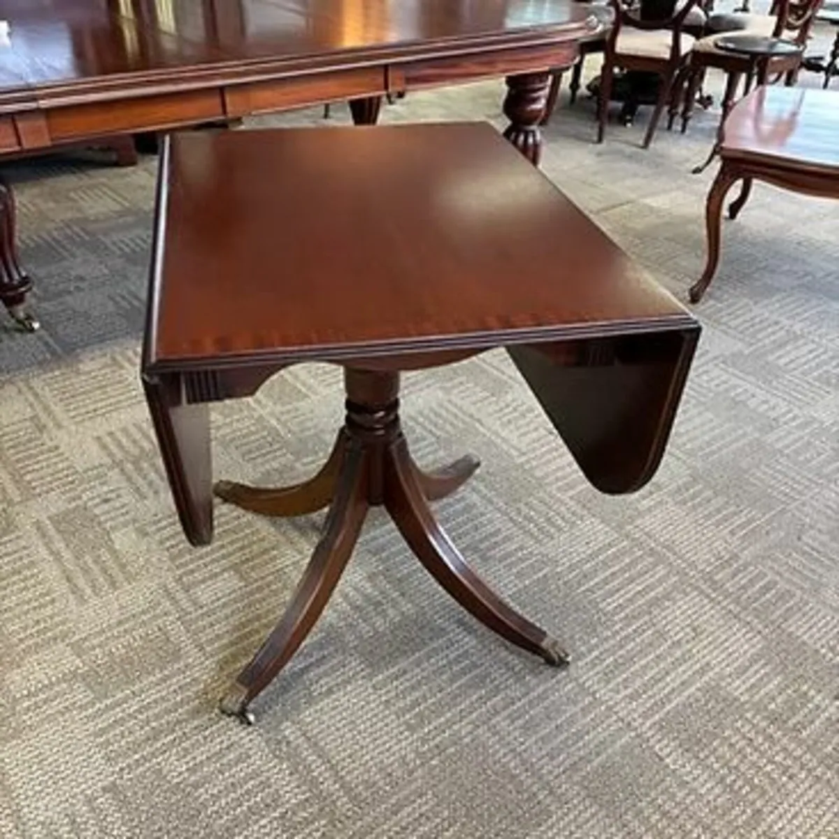 Beautiful mahogany drop leaf / tea table. On caste
