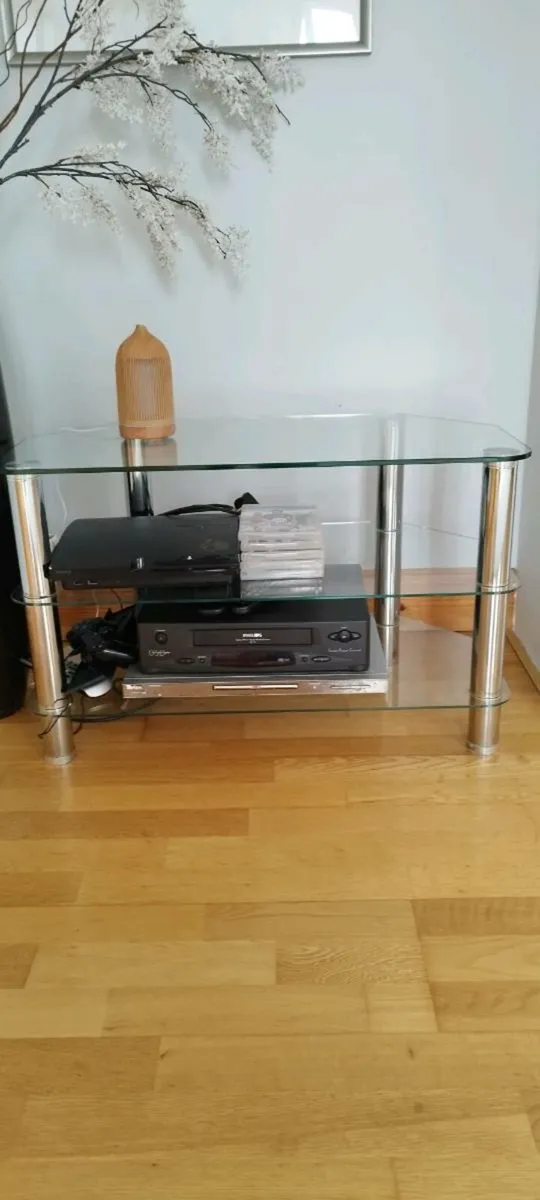 Glass TV stand for sale. - Image 1