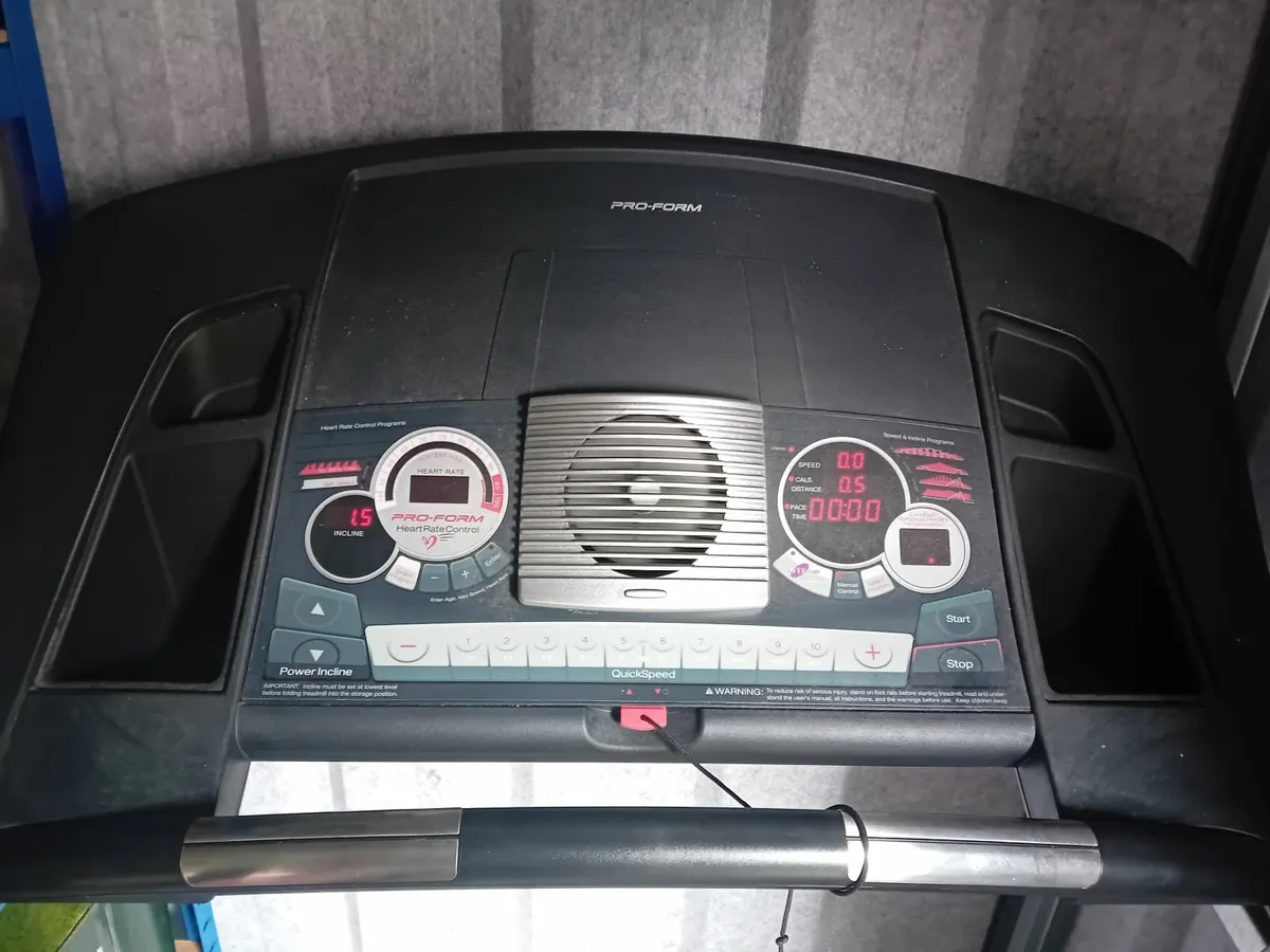 Treadmill and gym equipment. - Image 1