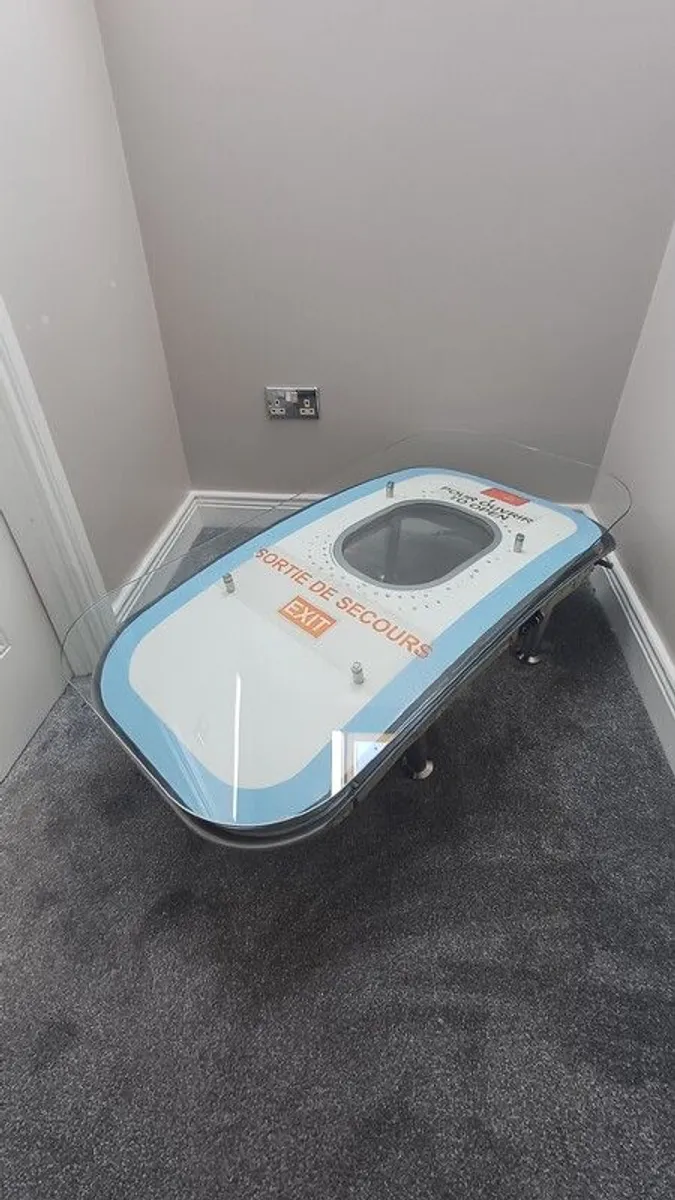 Coffee Table Crafted from an Upcycled Airbus A320 Aircraft Emergency Exit Door - Image 1