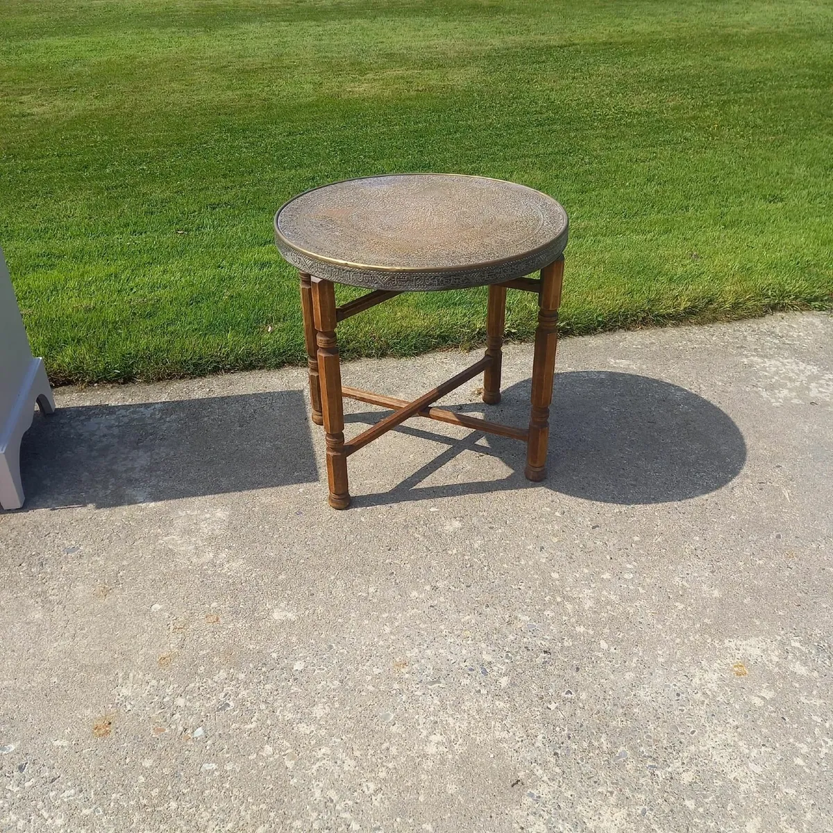 Round Table with Brass covered top.