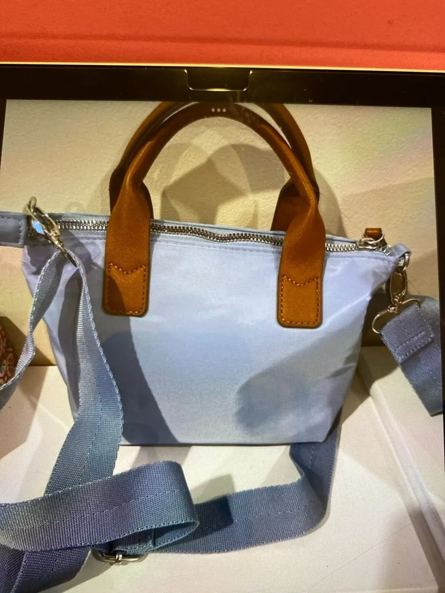 Beautiful blue cross over bag