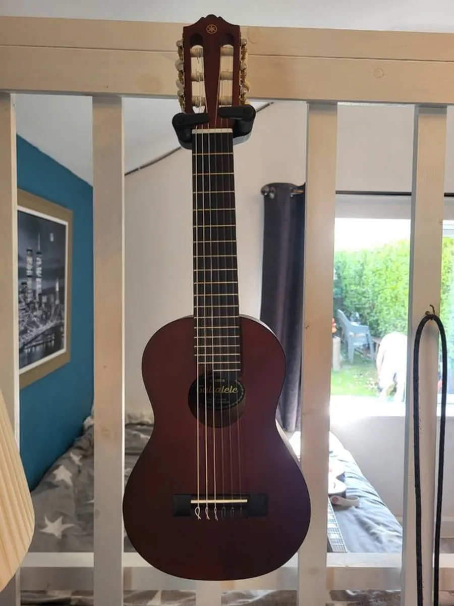 Guitar / Ukulele - Image 1